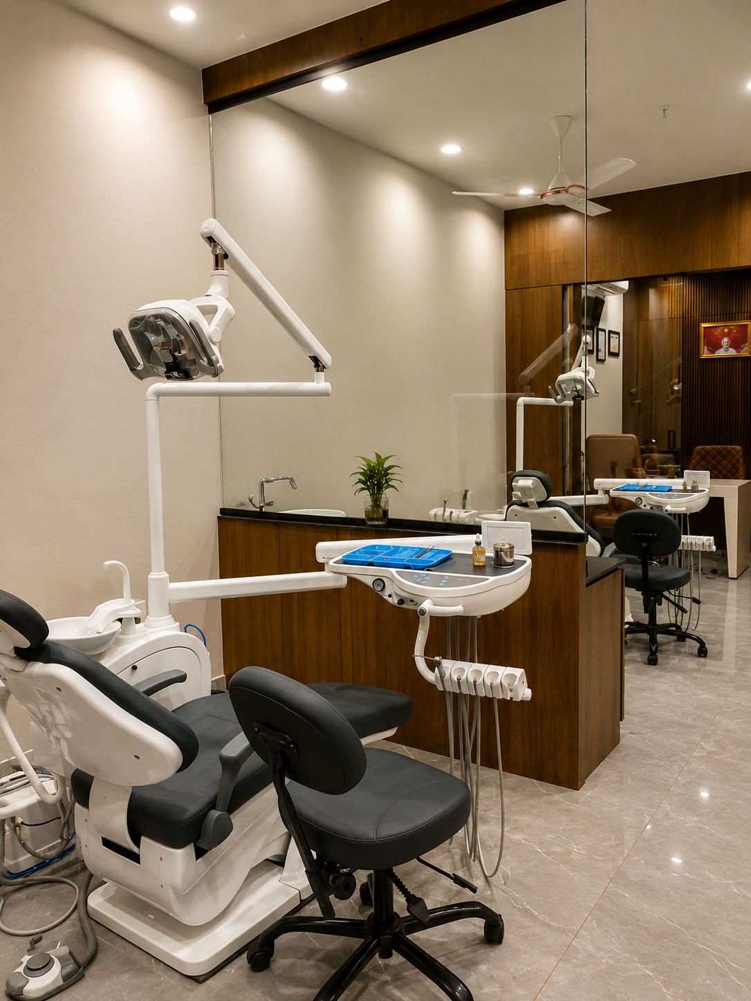 Modern treatment room with dental chair and mirrored wall